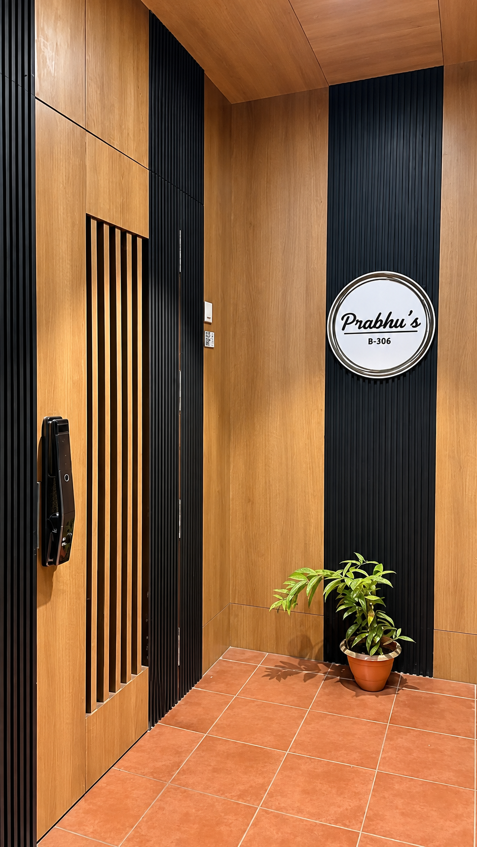 Flat B306 Wood-and-Black-Slat Foyer Prabhu's Nameplate
